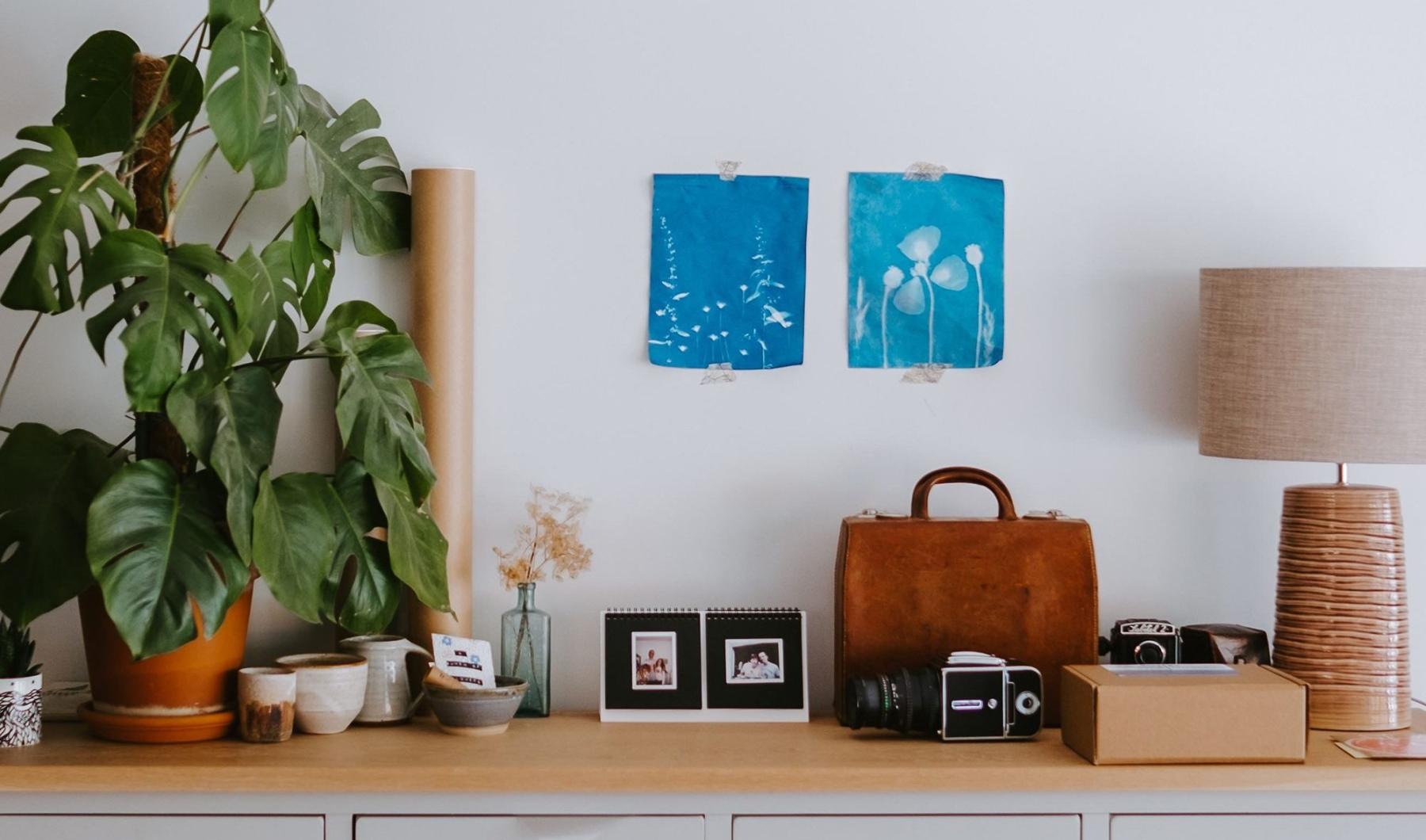 large dresser with a variety of decor on it